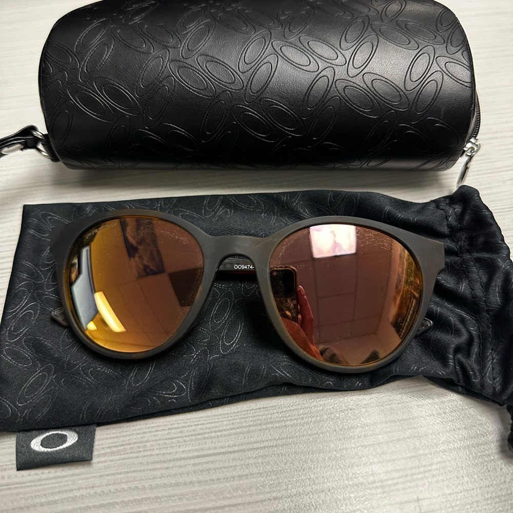 Oakley Black and Gold Sunglasses with Mirrored Lenses